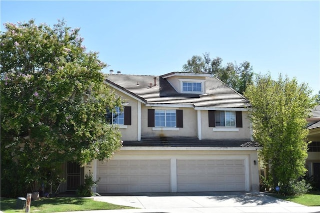 view of front of property with a garage