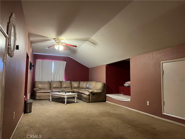 living room with vaulted ceiling, ceiling fan, and carpet