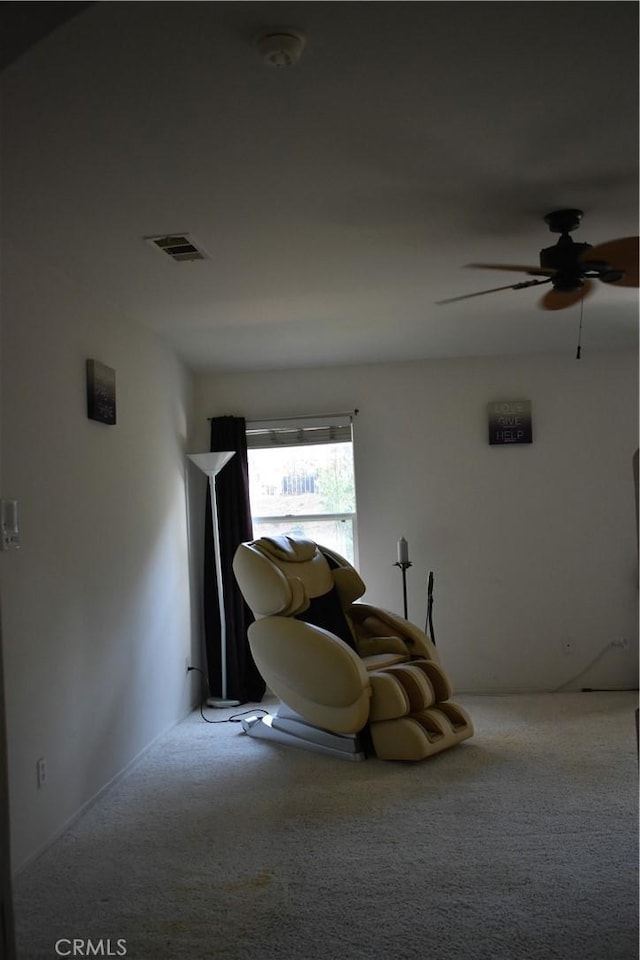 bedroom with ceiling fan and light carpet