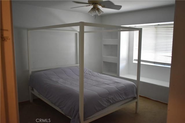 bedroom with ceiling fan and carpet floors