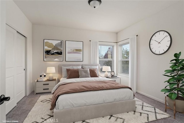 carpeted bedroom featuring a closet