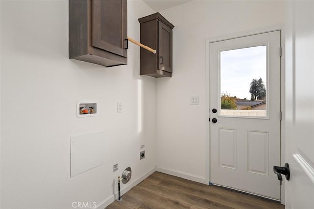 laundry area featuring electric dryer hookup, hookup for a washing machine, cabinets, and dark hardwood / wood-style floors