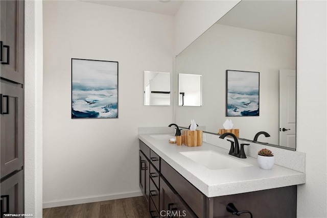 bathroom with hardwood / wood-style floors and vanity