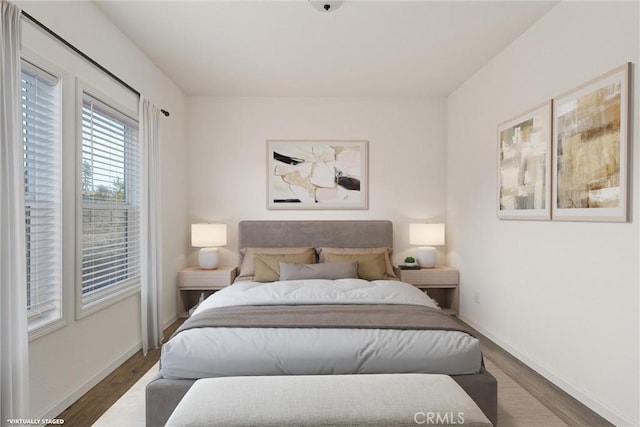 bedroom featuring dark wood-type flooring