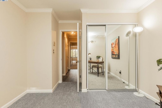 hallway with carpet and ornamental molding