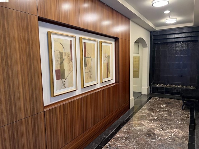 hallway with wooden walls