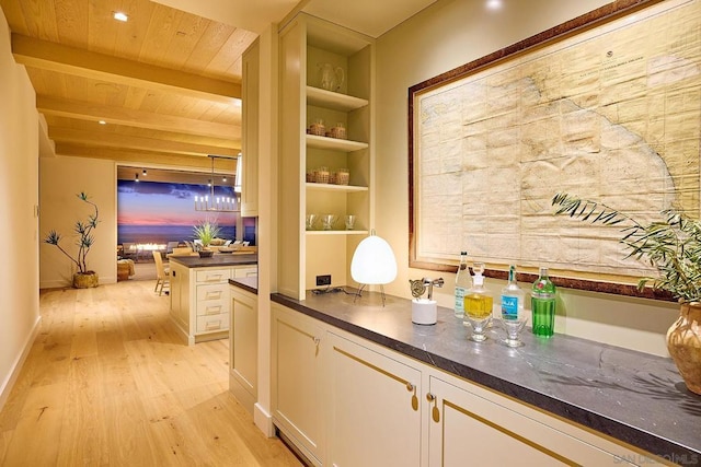 bar with light wood-type flooring, white cabinets, wood ceiling, beamed ceiling, and hanging light fixtures