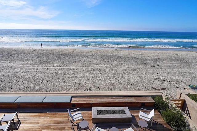 property view of water featuring a beach view and a fire pit