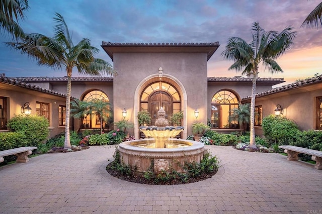 view of patio terrace at dusk