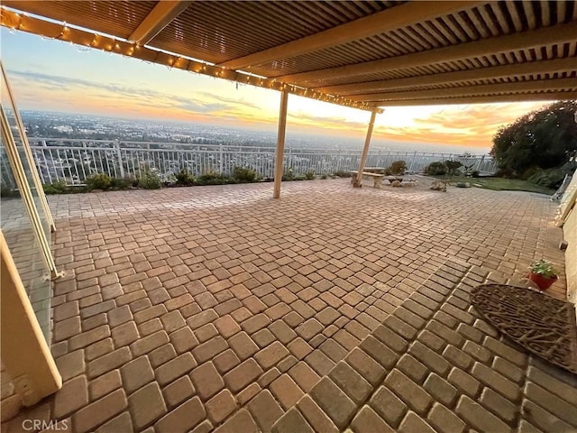 view of patio terrace at dusk