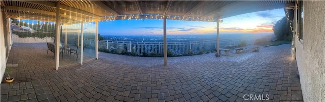 view of patio terrace at dusk