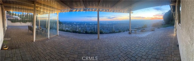 view of patio terrace at dusk