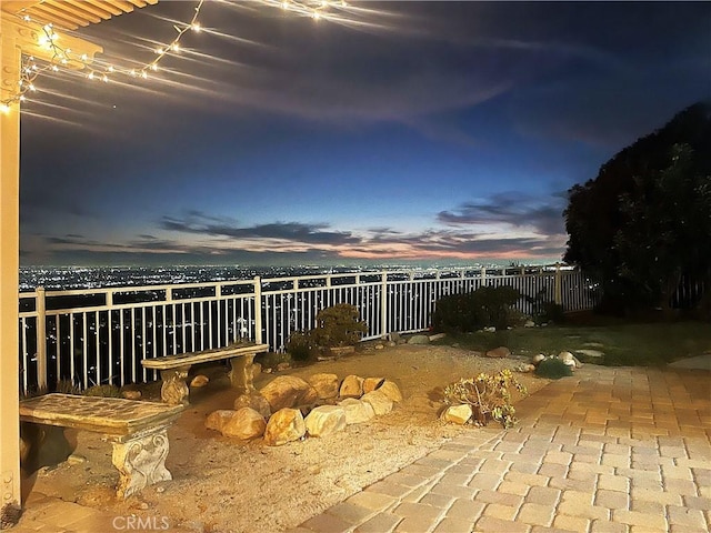 view of patio terrace at dusk