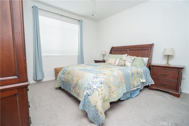 bedroom with light colored carpet