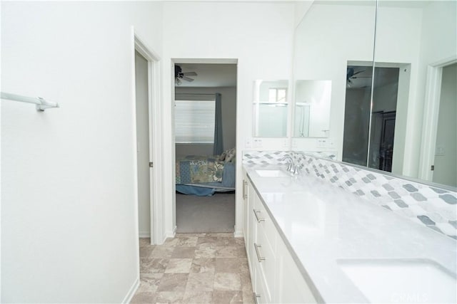 bathroom with ceiling fan and vanity