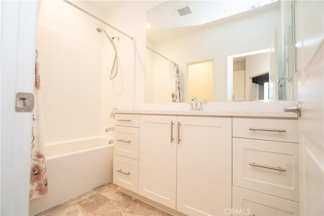 bathroom with vanity and shower / bath combo with shower curtain