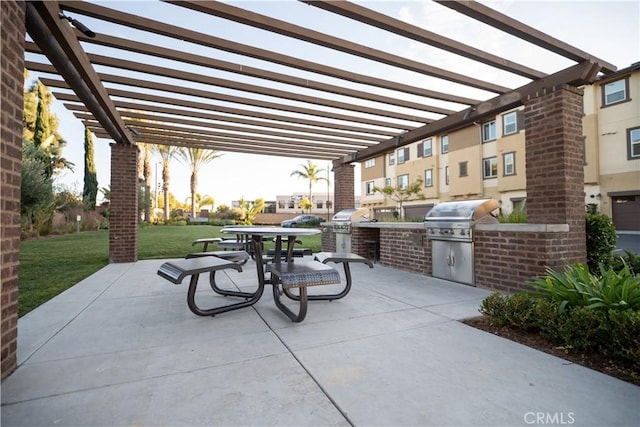 patio terrace at dusk featuring a lawn, area for grilling, a grill, and a pergola