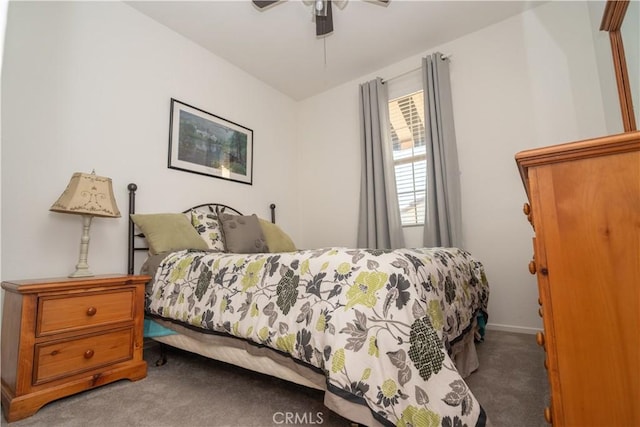 bedroom featuring ceiling fan and carpet