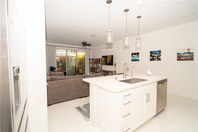 kitchen with white cabinetry, dishwasher, sink, ceiling fan, and decorative light fixtures