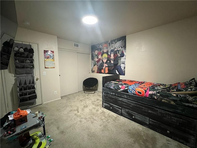 carpeted bedroom featuring a closet