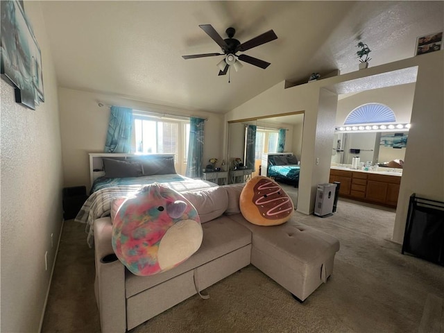 bedroom with carpet floors, a closet, vaulted ceiling, and ceiling fan