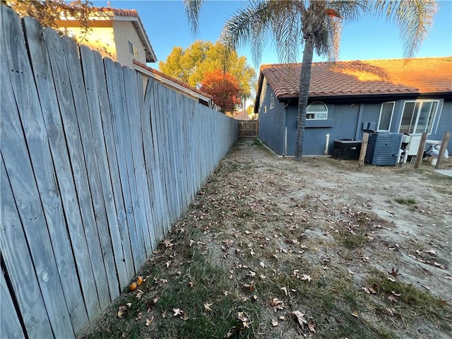 view of yard with central AC