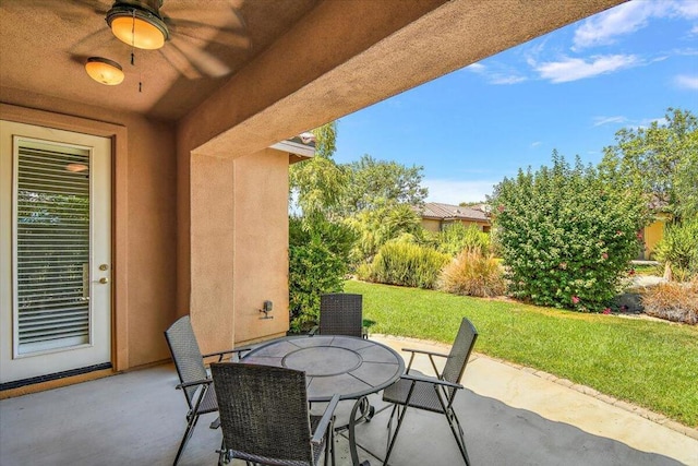 view of patio featuring ceiling fan