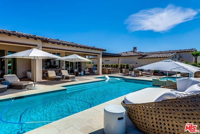 view of pool featuring a patio