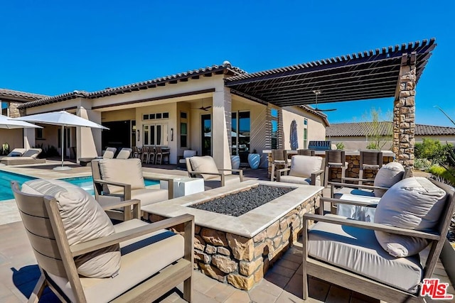 view of patio featuring an outdoor fire pit