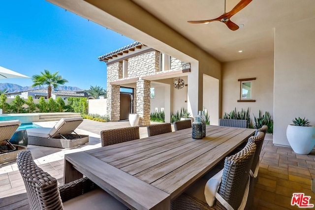 view of patio / terrace featuring ceiling fan