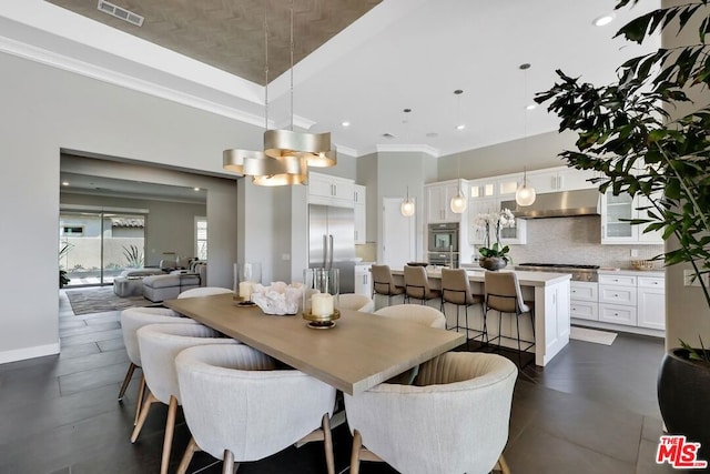 dining area featuring crown molding