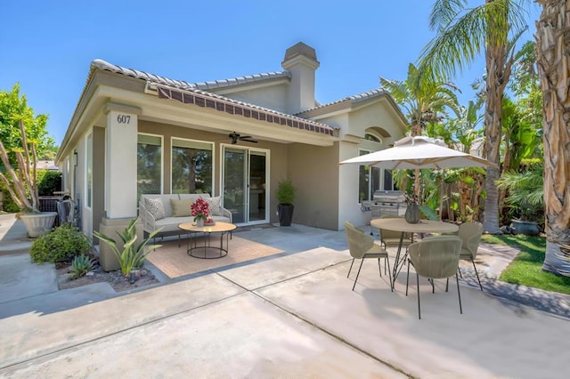 back of house with a patio area and ceiling fan