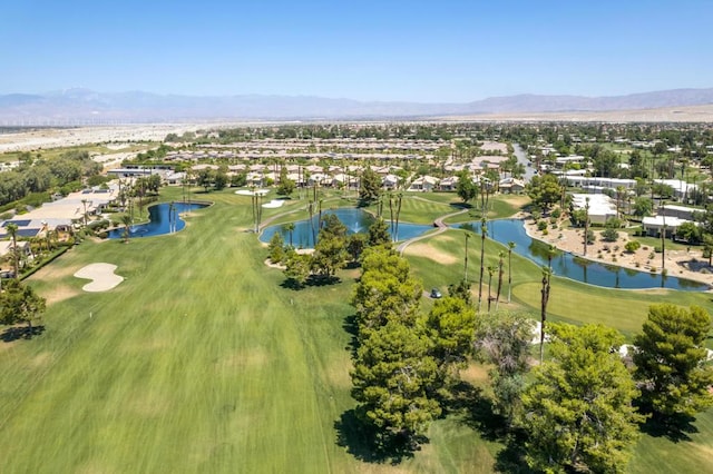 aerial view featuring a water and mountain view