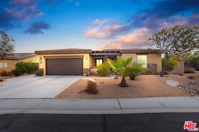 view of front of property with a garage