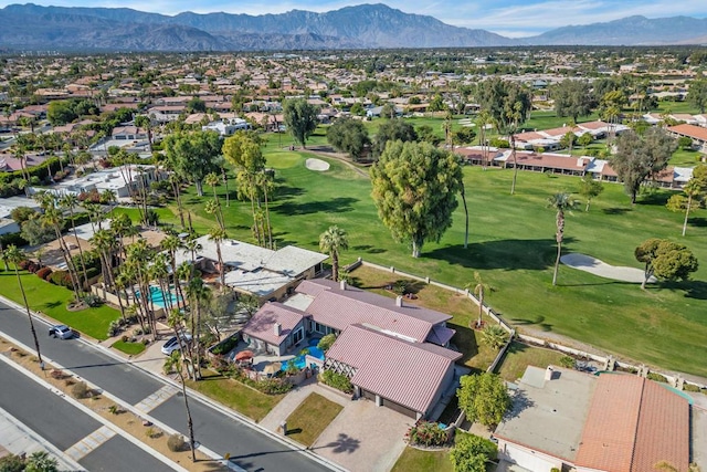 birds eye view of property with a mountain view