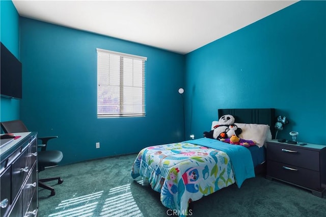 bedroom with dark colored carpet