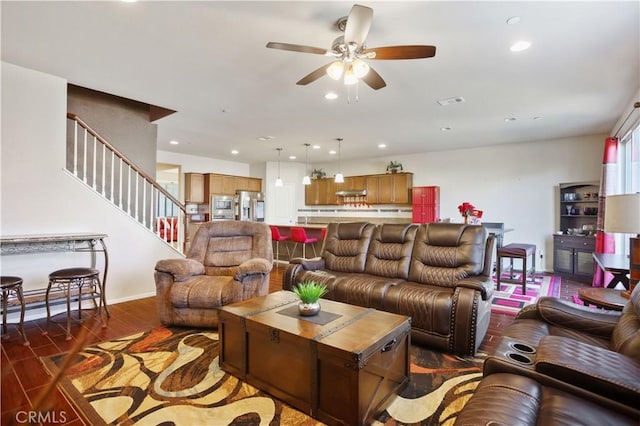 living room featuring dark hardwood / wood-style flooring and ceiling fan