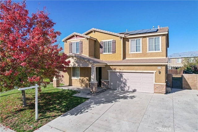 craftsman house featuring solar panels and a garage