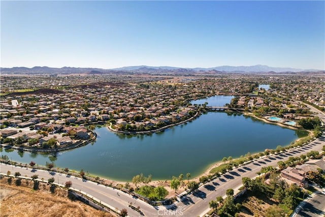 bird's eye view with a water and mountain view