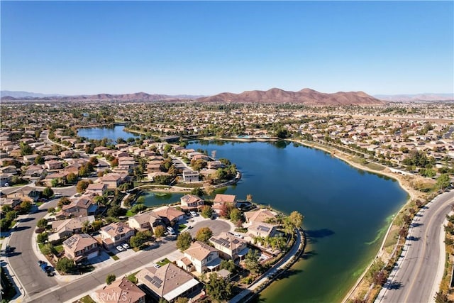 birds eye view of property featuring a water and mountain view