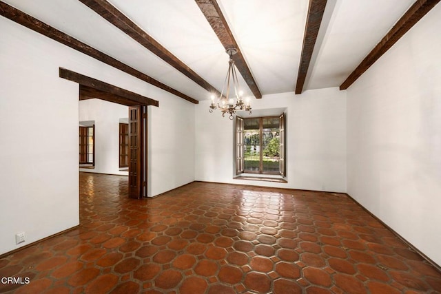 empty room with beamed ceiling and a notable chandelier