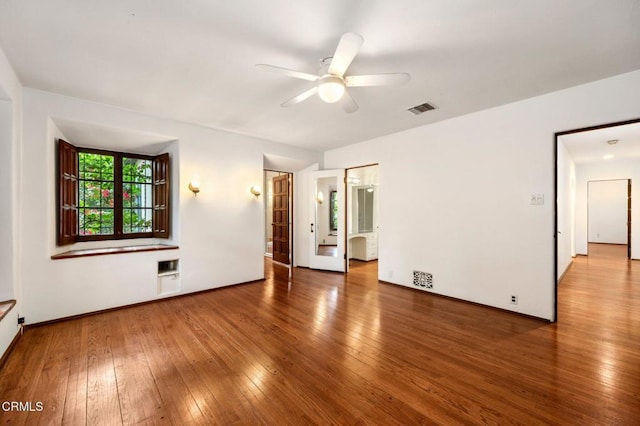 unfurnished room featuring ceiling fan and wood-type flooring