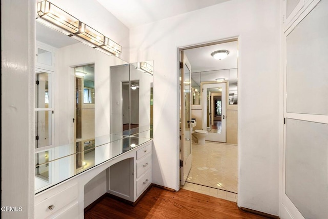 bathroom featuring hardwood / wood-style floors and toilet