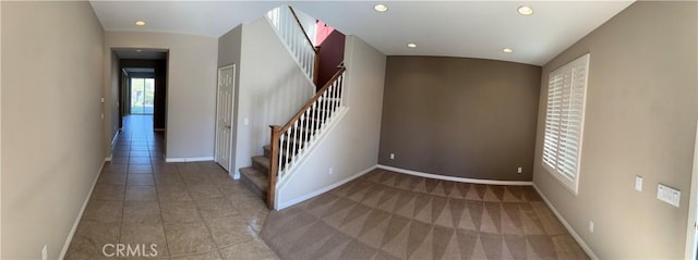 staircase with tile patterned flooring