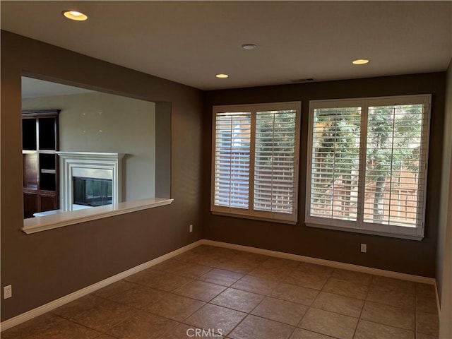 empty room with tile patterned flooring