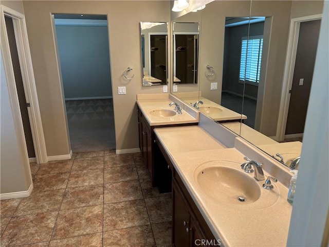 bathroom featuring tile patterned flooring and vanity