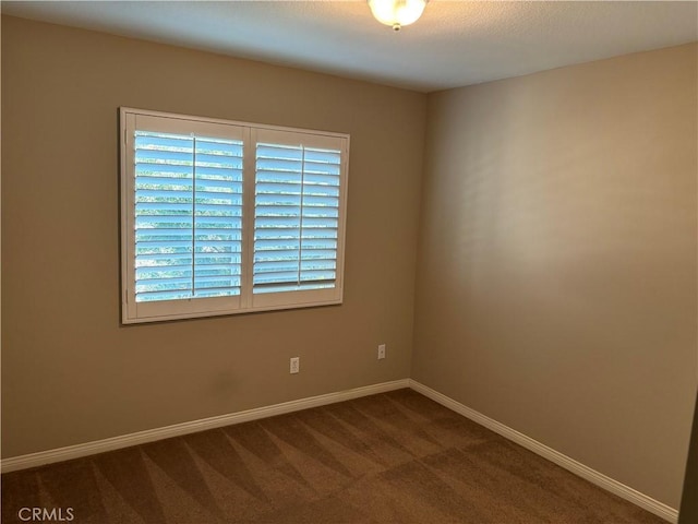 unfurnished room featuring carpet floors