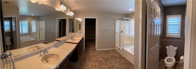 full bathroom featuring tile patterned flooring, vanity, toilet, and independent shower and bath