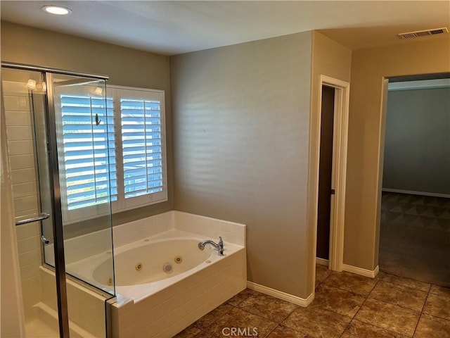 bathroom with tile patterned floors, plenty of natural light, and shower with separate bathtub