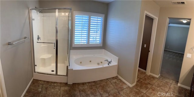 bathroom featuring tile patterned flooring and shower with separate bathtub